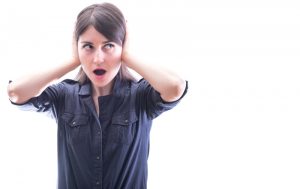 woman covering her ears, isolated on a white background