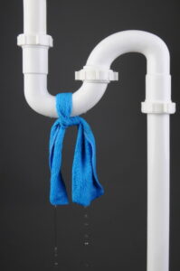 blue-cloth-tied-around-white-pipe