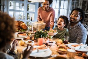 family-sitting-around-table-for-holiday-meal