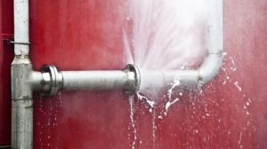 water-spraying-out-of-a-damaged-pipe